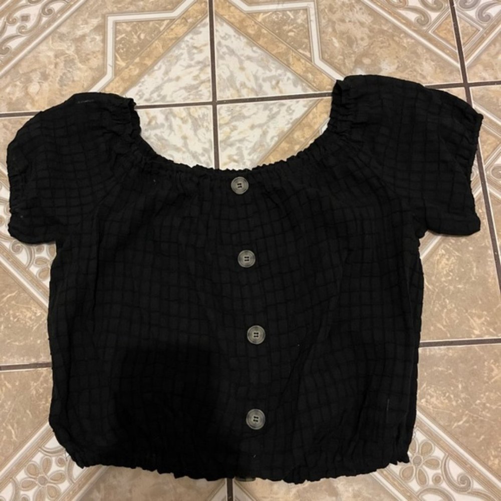 Black shirt with buttons.
